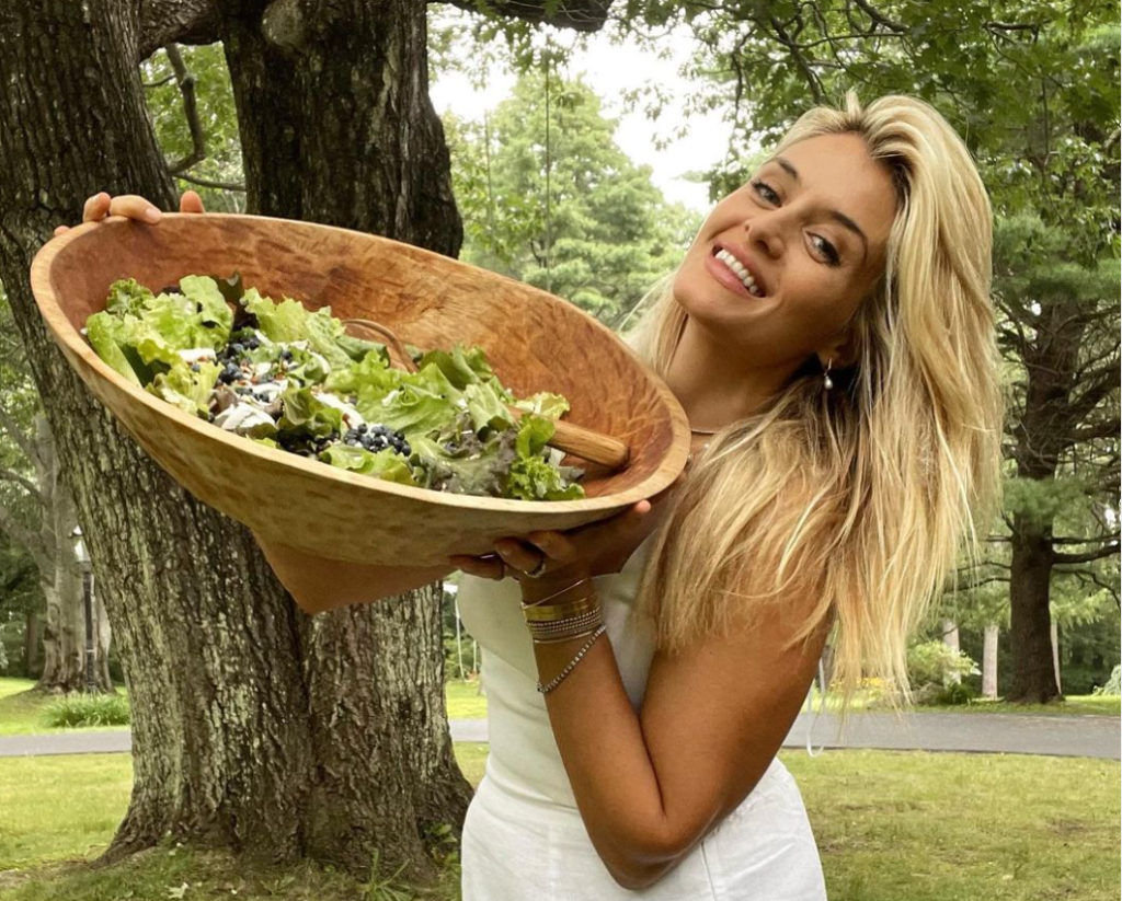 Daphne Oz posing with a salad in 2023