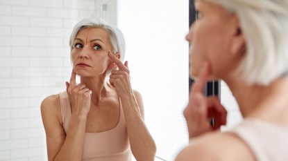 woman concerned about her skin, it could be due to common makeup mistakes