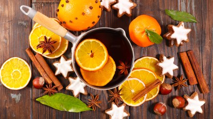pot with citrus slices, cinnamon cloves and more; simmer pot recipes