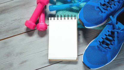 workout equipment: sneakers, light weights, jump rope and towel