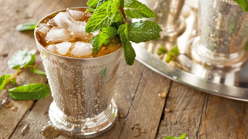 A mint julep (classic Kentucky Derby drink) served in a silver cup and garnish with fresh mint