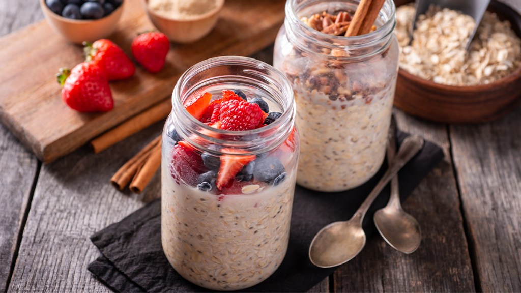 Jar of overnight oats topped with berries