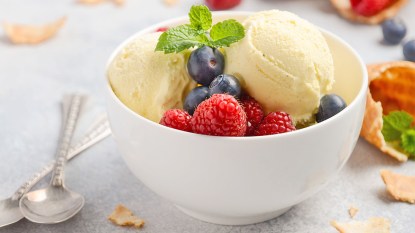 Vanilla protein ice cream served in a bowl with berries